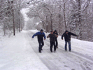 Ensemble members on a snowy road. 2006 tour of USA